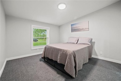 This remodeled ranch home in a gated community boasts four on Linn Valley Lakes - Deer Trace Golf Course in Kansas - for sale on GolfHomes.com, golf home, golf lot