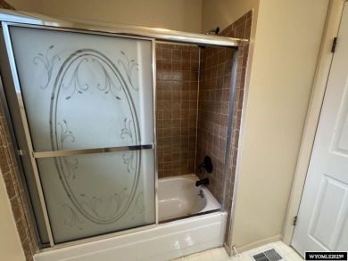 Welcome home to this thoughtfully updated tri-level townhouse on Riverton Country Club in Wyoming - for sale on GolfHomes.com, golf home, golf lot