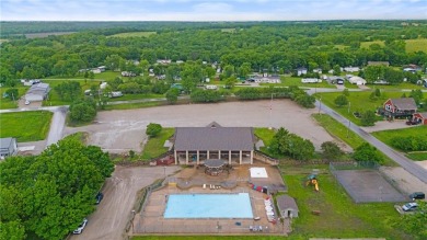 This remodeled ranch home in a gated community boasts four on Linn Valley Lakes - Deer Trace Golf Course in Kansas - for sale on GolfHomes.com, golf home, golf lot