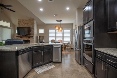 Tucked at the end of a quiet cul-de-sac, this thoughtfully on Apple Rock Golf Course - Horseshoe Bay in Texas - for sale on GolfHomes.com, golf home, golf lot