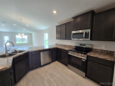 This 2020 sq. ft. home on a cul-de-sac has a partial view of the on Twisted Oaks Golf Club in Florida - for sale on GolfHomes.com, golf home, golf lot