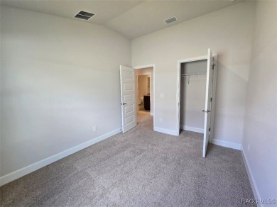This 2020 sq. ft. home on a cul-de-sac has a partial view of the on Twisted Oaks Golf Club in Florida - for sale on GolfHomes.com, golf home, golf lot