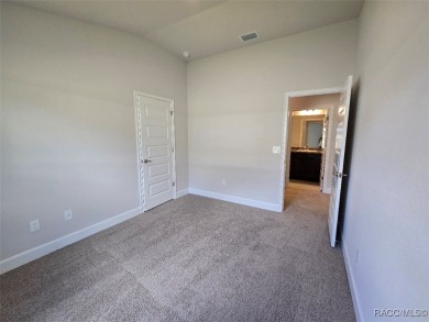 This 2020 sq. ft. home on a cul-de-sac has a partial view of the on Twisted Oaks Golf Club in Florida - for sale on GolfHomes.com, golf home, golf lot