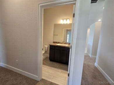 This 2020 sq. ft. home on a cul-de-sac has a partial view of the on Twisted Oaks Golf Club in Florida - for sale on GolfHomes.com, golf home, golf lot
