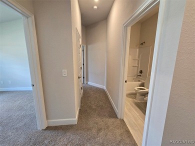 This 2020 sq. ft. home on a cul-de-sac has a partial view of the on Twisted Oaks Golf Club in Florida - for sale on GolfHomes.com, golf home, golf lot
