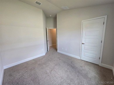 This 2020 sq. ft. home on a cul-de-sac has a partial view of the on Twisted Oaks Golf Club in Florida - for sale on GolfHomes.com, golf home, golf lot