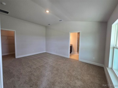 This 2020 sq. ft. home on a cul-de-sac has a partial view of the on Twisted Oaks Golf Club in Florida - for sale on GolfHomes.com, golf home, golf lot