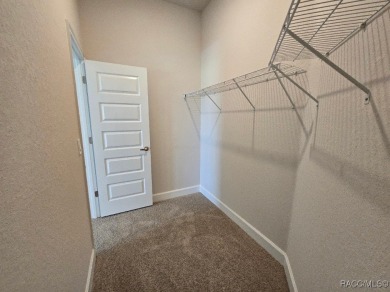 This 2020 sq. ft. home on a cul-de-sac has a partial view of the on Twisted Oaks Golf Club in Florida - for sale on GolfHomes.com, golf home, golf lot