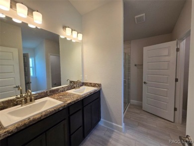 This 2020 sq. ft. home on a cul-de-sac has a partial view of the on Twisted Oaks Golf Club in Florida - for sale on GolfHomes.com, golf home, golf lot