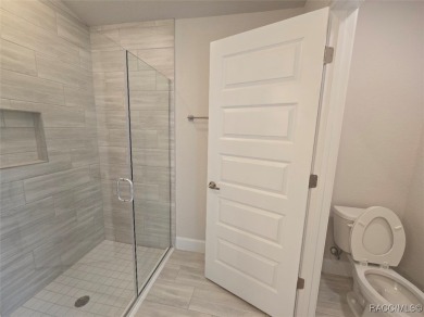 This 2020 sq. ft. home on a cul-de-sac has a partial view of the on Twisted Oaks Golf Club in Florida - for sale on GolfHomes.com, golf home, golf lot