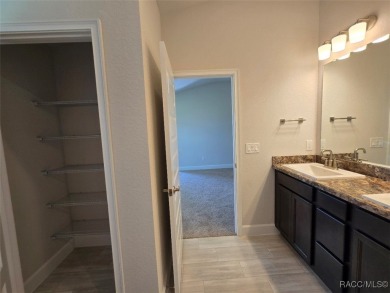 This 2020 sq. ft. home on a cul-de-sac has a partial view of the on Twisted Oaks Golf Club in Florida - for sale on GolfHomes.com, golf home, golf lot