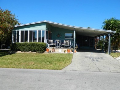 This 26x48 1984 Ventura home is located on a coveted corner lot on Grasslands Golf and Country Club in Florida - for sale on GolfHomes.com, golf home, golf lot