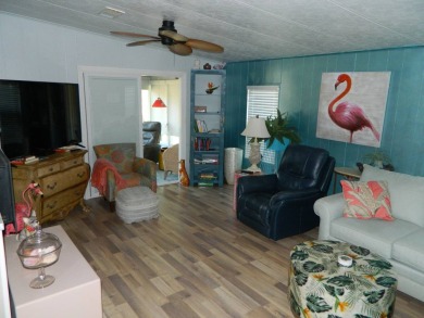 This 26x48 1984 Ventura home is located on a coveted corner lot on Grasslands Golf and Country Club in Florida - for sale on GolfHomes.com, golf home, golf lot