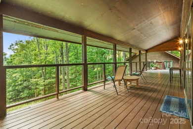 Secluded mountain cabin on three lots totaling 2.74 acres with on Wolf Laurel Country Club in North Carolina - for sale on GolfHomes.com, golf home, golf lot
