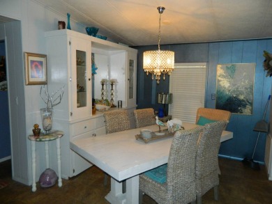 This 26x48 1984 Ventura home is located on a coveted corner lot on Grasslands Golf and Country Club in Florida - for sale on GolfHomes.com, golf home, golf lot
