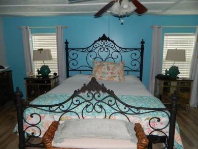 This 26x48 1984 Ventura home is located on a coveted corner lot on Grasslands Golf and Country Club in Florida - for sale on GolfHomes.com, golf home, golf lot