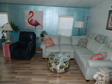 This 26x48 1984 Ventura home is located on a coveted corner lot on Grasslands Golf and Country Club in Florida - for sale on GolfHomes.com, golf home, golf lot