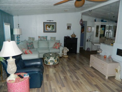 This 26x48 1984 Ventura home is located on a coveted corner lot on Grasslands Golf and Country Club in Florida - for sale on GolfHomes.com, golf home, golf lot