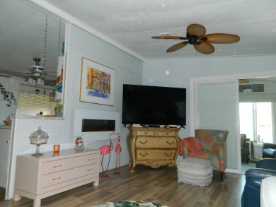 This 26x48 1984 Ventura home is located on a coveted corner lot on Grasslands Golf and Country Club in Florida - for sale on GolfHomes.com, golf home, golf lot