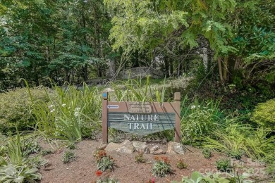 Secluded mountain cabin on three lots totaling 2.74 acres with on Wolf Laurel Country Club in North Carolina - for sale on GolfHomes.com, golf home, golf lot
