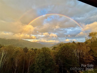 Secluded mountain cabin on three lots totaling 2.74 acres with on Wolf Laurel Country Club in North Carolina - for sale on GolfHomes.com, golf home, golf lot