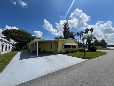 You can't beat the location of this spectacular two-bed on Lake Henry Golf Club in Florida - for sale on GolfHomes.com, golf home, golf lot