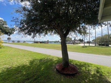 You can't beat the location of this spectacular two-bed on Lake Henry Golf Club in Florida - for sale on GolfHomes.com, golf home, golf lot