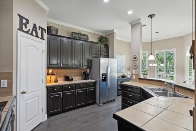 Nestled on a private, gated street overlooking the manicured on Iron Horse Golf Course in Texas - for sale on GolfHomes.com, golf home, golf lot