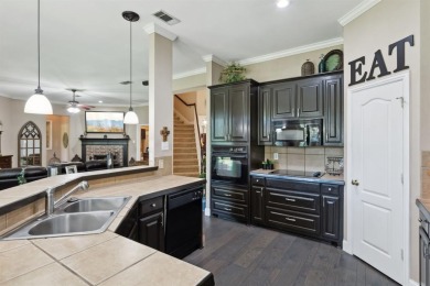 Nestled on a private, gated street overlooking the manicured on Iron Horse Golf Course in Texas - for sale on GolfHomes.com, golf home, golf lot