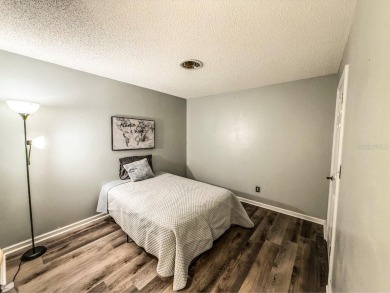 Welcome to Whispering Oaks Estates, where maintenance-free on The Ridge Manor Oaks Golf and Country Club in Florida - for sale on GolfHomes.com, golf home, golf lot