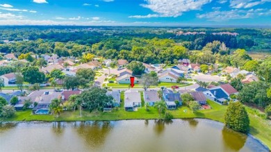 Welcome to your relaxing waterfront retreat! This 3 bedroom 2 on Countryway Golf Course in Florida - for sale on GolfHomes.com, golf home, golf lot