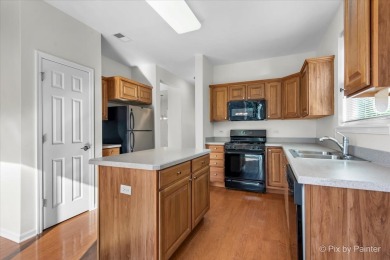Step into this well-cared-for Mackinac model, freshly painted on Whisper Creek Golf Club in Illinois - for sale on GolfHomes.com, golf home, golf lot