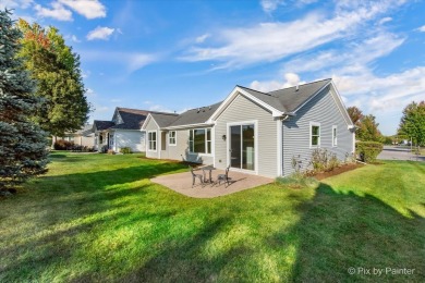 Step into this well-cared-for Mackinac model, freshly painted on Whisper Creek Golf Club in Illinois - for sale on GolfHomes.com, golf home, golf lot