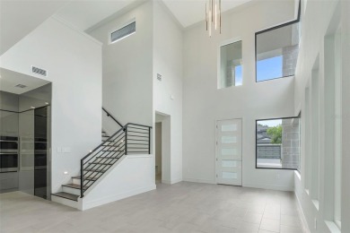 Beautiful, contemporary Aspen II model by ABD Development in on Providence Golf Club in Florida - for sale on GolfHomes.com, golf home, golf lot