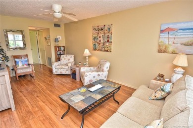 Step into this cozy, beachy-theamed condo and you won't want to on Pine Lakes Golf Club in Florida - for sale on GolfHomes.com, golf home, golf lot