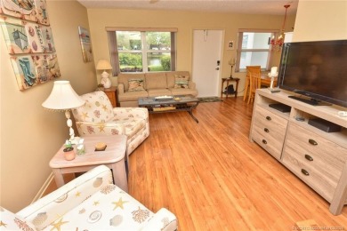 Step into this cozy, beachy-theamed condo and you won't want to on Pine Lakes Golf Club in Florida - for sale on GolfHomes.com, golf home, golf lot