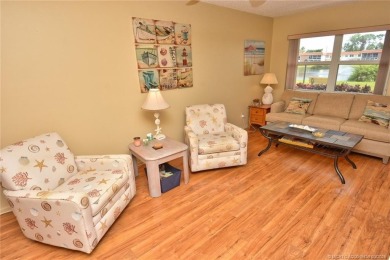 Step into this cozy, beachy-theamed condo and you won't want to on Pine Lakes Golf Club in Florida - for sale on GolfHomes.com, golf home, golf lot