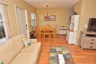 Step into this cozy, beachy-theamed condo and you won't want to on Pine Lakes Golf Club in Florida - for sale on GolfHomes.com, golf home, golf lot