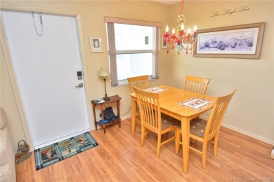Step into this cozy, beachy-theamed condo and you won't want to on Pine Lakes Golf Club in Florida - for sale on GolfHomes.com, golf home, golf lot