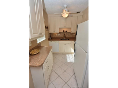 This first floor one bedroom, corner location with one and a on Pine Lakes Golf Club in Florida - for sale on GolfHomes.com, golf home, golf lot