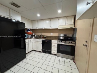 Spacious first-floor 2/2 unit is located in the gated on Inverrary Country Club in Florida - for sale on GolfHomes.com, golf home, golf lot