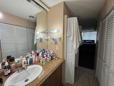 Spacious first-floor 2/2 unit is located in the gated on Inverrary Country Club in Florida - for sale on GolfHomes.com, golf home, golf lot