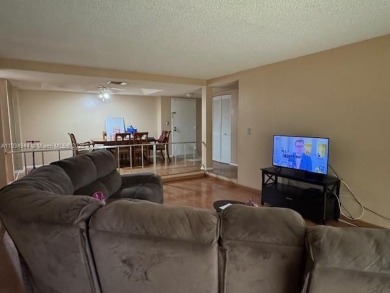 Spacious first-floor 2/2 unit is located in the gated on Inverrary Country Club in Florida - for sale on GolfHomes.com, golf home, golf lot