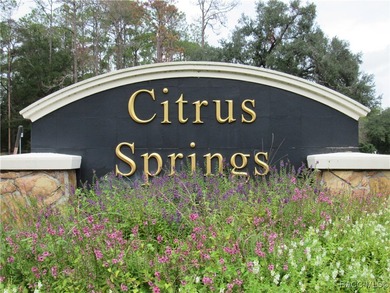 Charming three-bedroom, two-bathroom home featuring a two-car on Pine Ridge Community Golf and Country Club in Florida - for sale on GolfHomes.com, golf home, golf lot