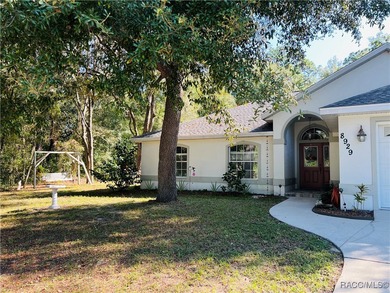 Charming three-bedroom, two-bathroom home featuring a two-car on Pine Ridge Community Golf and Country Club in Florida - for sale on GolfHomes.com, golf home, golf lot