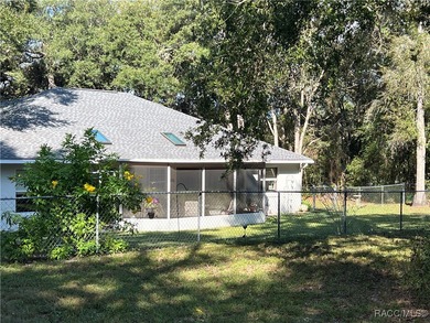 Charming three-bedroom, two-bathroom home featuring a two-car on Pine Ridge Community Golf and Country Club in Florida - for sale on GolfHomes.com, golf home, golf lot