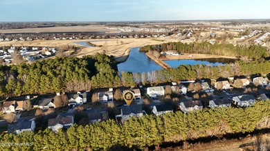 Bring the family to this spacious home featuring 6 bedrooms or 5 on Eagle Creek Golf Club and Grill in North Carolina - for sale on GolfHomes.com, golf home, golf lot