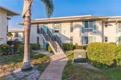 Wonderful second floor unit looking out on the water of the on The Glades Golf and Country Club in Florida - for sale on GolfHomes.com, golf home, golf lot