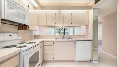 Stunning 2BR/2BA Corner Unit with Golf  Lake Views, Prime Davie on Pine Island Ridge Country Club in Florida - for sale on GolfHomes.com, golf home, golf lot