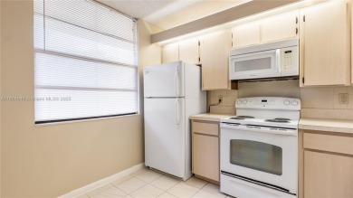 Stunning 2BR/2BA Corner Unit with Golf  Lake Views, Prime Davie on Pine Island Ridge Country Club in Florida - for sale on GolfHomes.com, golf home, golf lot